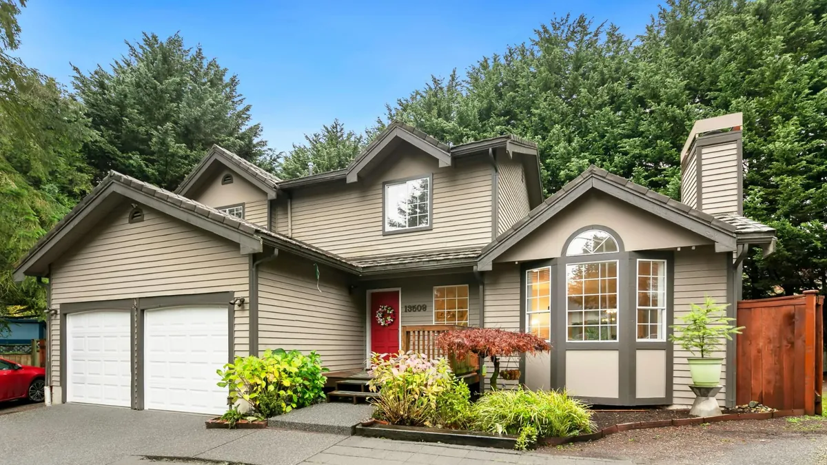 Residential street in Concord NC with established homes and mature trees